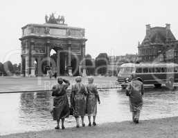 Tourists viewing the Arc de Triomphe du Carrousel at the Tuileries Gardens, July 15, 1953