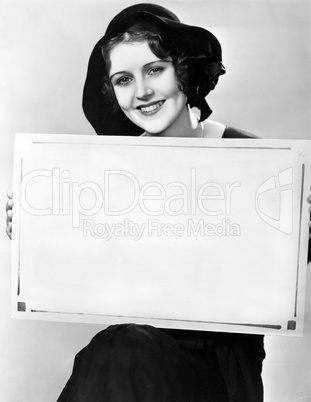 Portrait of woman holding sign in Hungarian