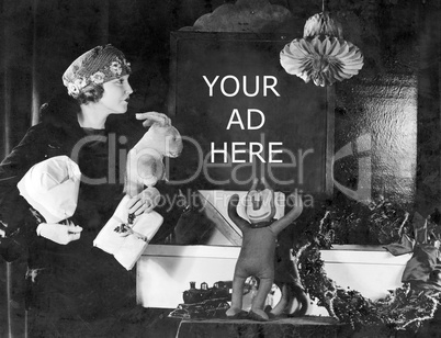 Woman holding presents reading sign