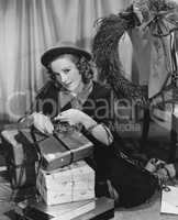 Portrait of woman wrapping Christmas presents