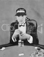 Portrait of gambler at card table