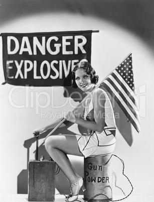 Portrait of woman with American flag and explosives