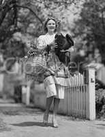 Woman carrying live turkey and grocery basket