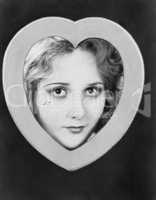 Womans face framed by heart