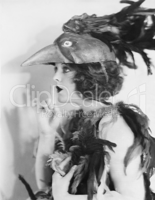 Portrait of woman wearing bird costume