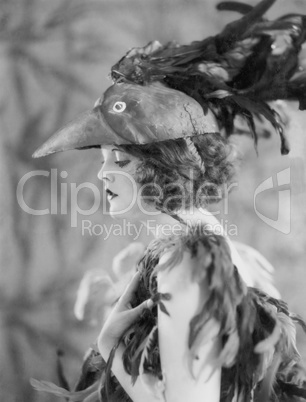 Portrait of woman wearing bird costume