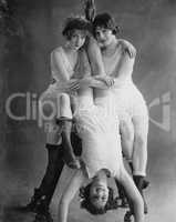 Portrait of three acrobatic women