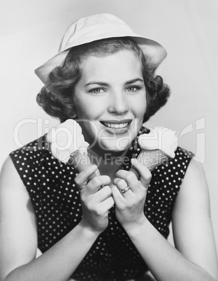Portrait of woman with two ice cream cones