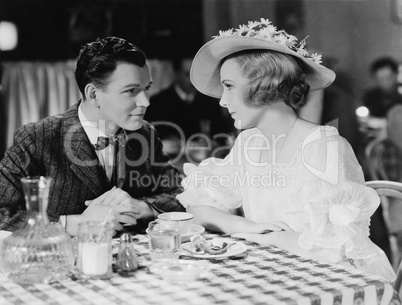 Young couple dining in restaurant