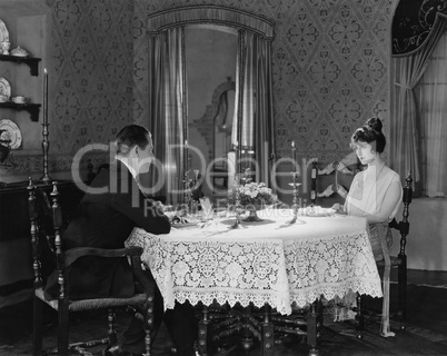 Couple having formal dinner at home