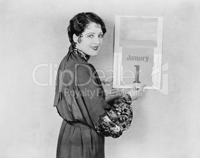 Woman with calendar on New Years Day