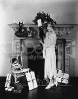 Woman stuffing Christmas stocking
