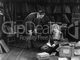 Man and woman with trunk full of papers