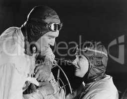 Couple in racing hats and goggles