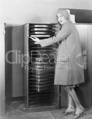 Woman with cabinet of movie production equipment