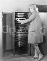 Woman with cabinet of movie production equipment