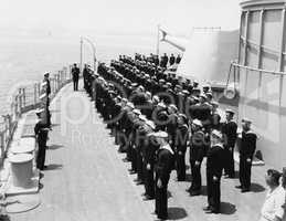 Sailors at attention on naval ship