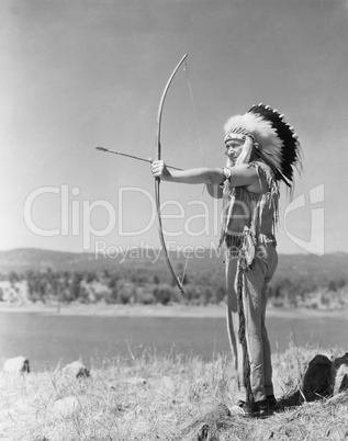 Man shooting with bow and arrow