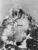 Triumphant woman at mountain summit