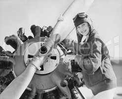 Portrait of woman with plane propeller
