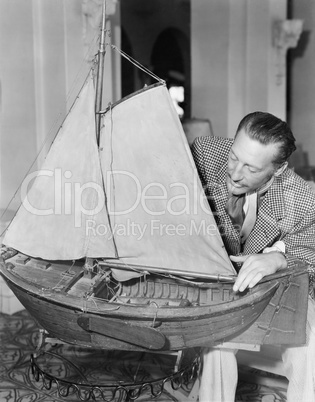 Man with model ship