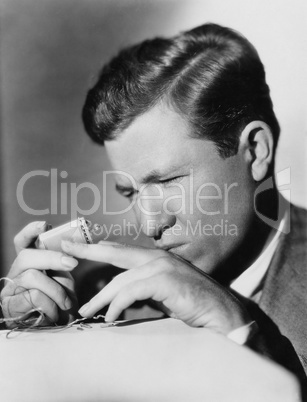 Closeup of man repairing lighter