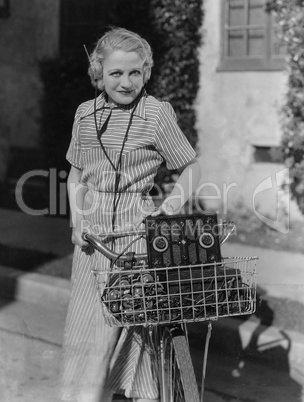 Woman with bicycle and radio