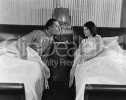 Couple in twin beds