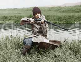 Female hunter with gun near river