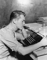 Man using typewriter