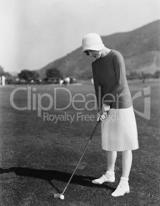 Woman playing golf