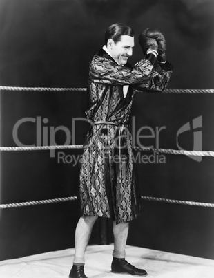 Victorious boxer in ring