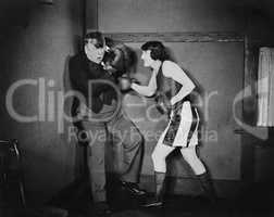 Man and woman boxing
