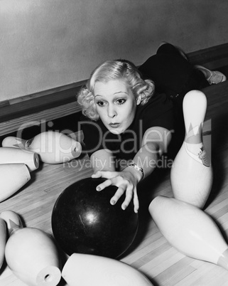 Woman having bowling accident