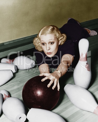 Woman having bowling accident