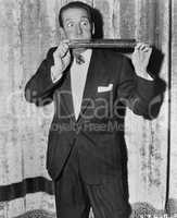 Portrait of man playing huge harmonica