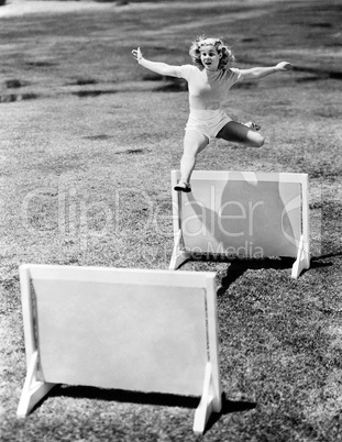 Woman jumping hurdles labeled with years