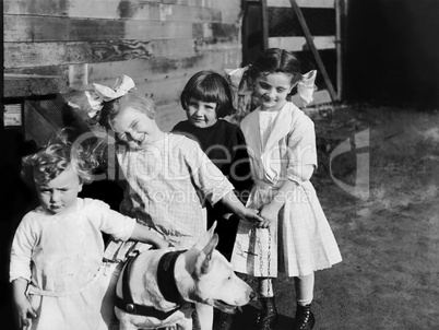 Portrait of children outside with dog