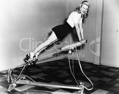 Woman using exercise equipment