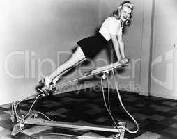 Woman using exercise equipment