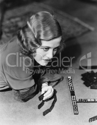 Closeup of woman playing dominos