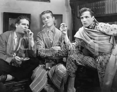 Three men smoking cigars