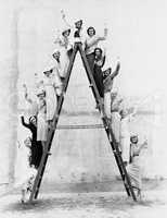 Group of women on tall ladder