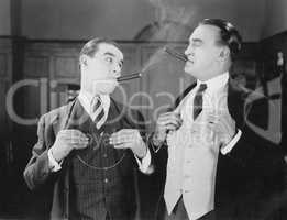Two men smoking cigars