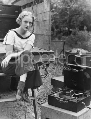 Portrait of woman with record player