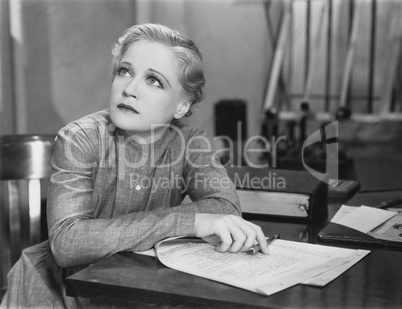 Woman writing at desk