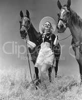 Cowgirl with two horses