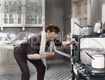 Man looking into oven