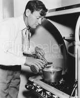 Man cooking on stove