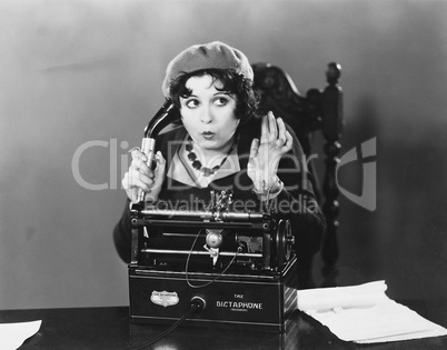 Woman using Dictaphone